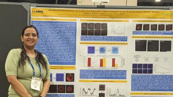 Pallavi in front of her poster at BPS, spring 2024